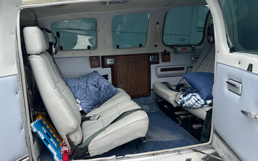Leather club seating inside the Baron 58 cabin