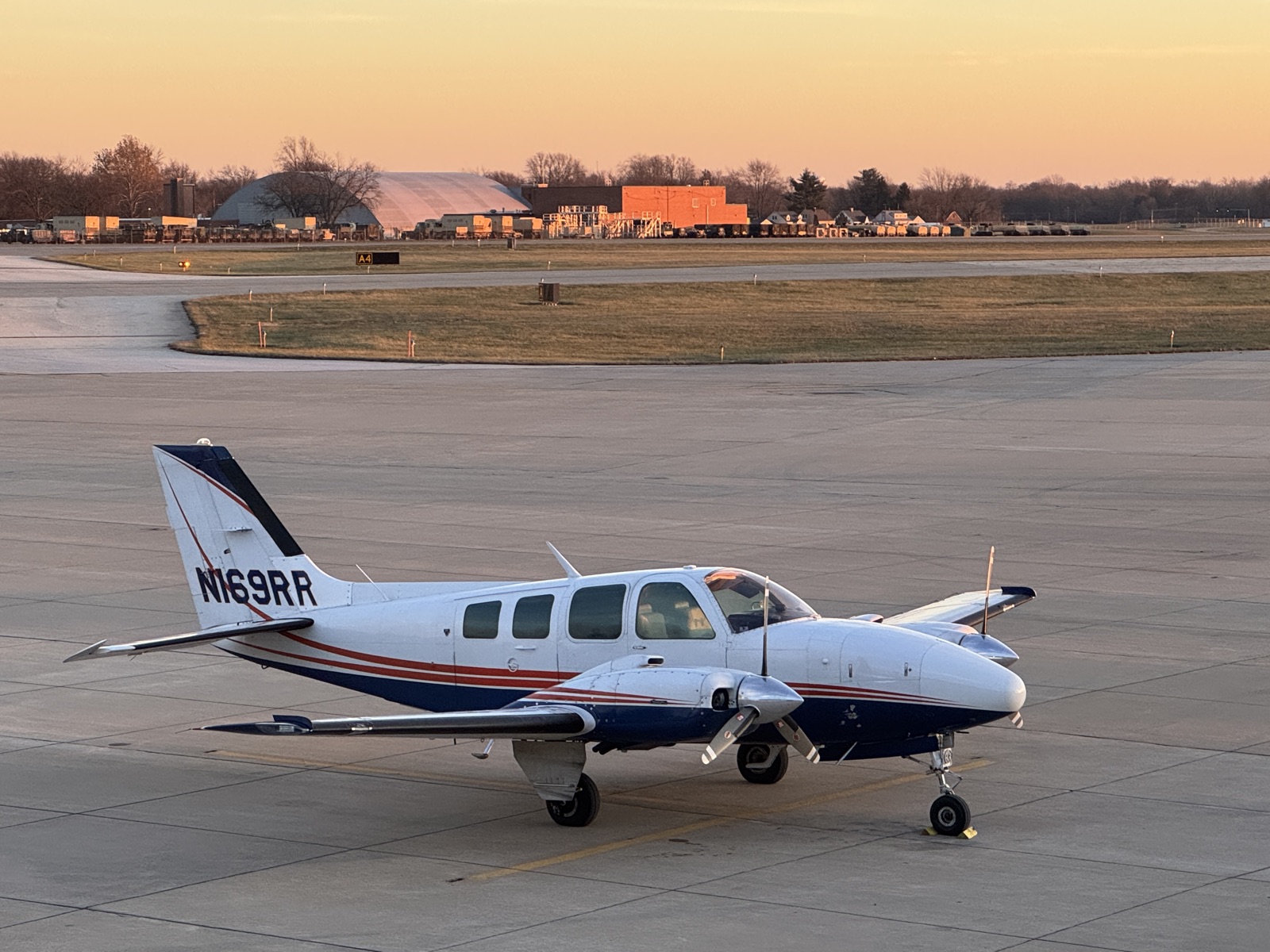 Beechcraft Baron 58 N169RR at golden hour