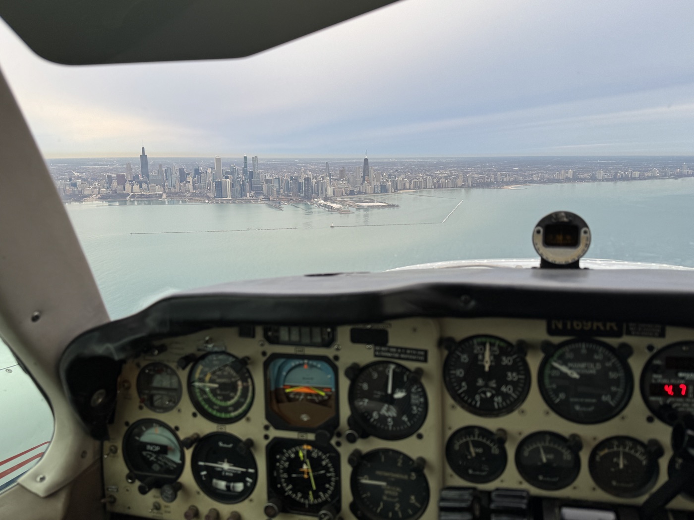 View from the cockpit of a Baron 58 over the Chicago skyline